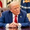 President Donald Trump signs an Executive Order alongside Kid Rock in the Oval Office, Monday, March 31, 2025. (Official White House Photo by Molly Riley)