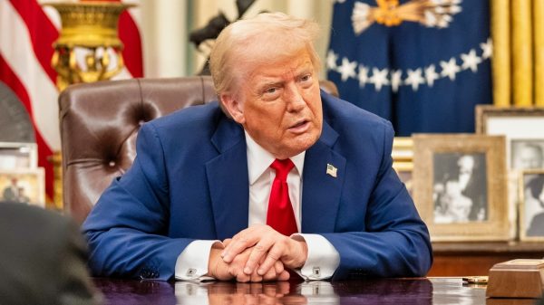 President Donald Trump signs an Executive Order alongside Kid Rock in the Oval Office, Monday, March 31, 2025. (Official White House Photo by Molly Riley)