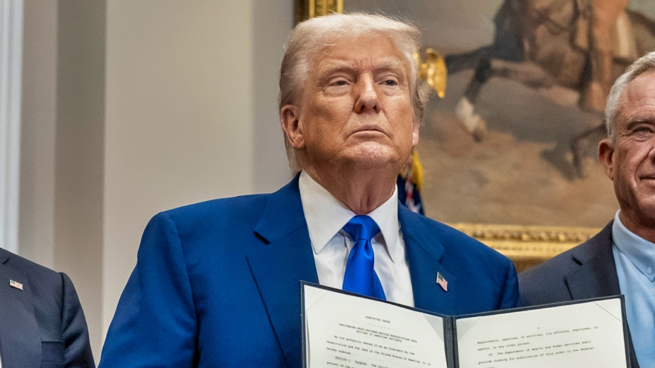 President Donald Trump signs an executive order on Delivering Most-Favored-Nation Prescription Drug Pricing to American Patient at a press conference with Health and Human Services Secretary Robert F. Kennedy Jr., Monday, May 12, 2025, in the Roosevelt Room. (Official White House Photo by Joyce N. Boghosian).