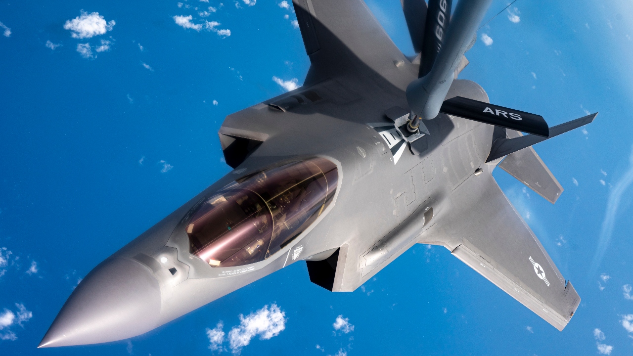 A U.S. Air Force F-35A Lightning II pilot assigned to the 421st Fisgter Squadron, Hill Air Force Base, Utah, receives fuel from a U.S. Air Force KC-135 Stratotanker aircraft assigned to the 506th Expeditionary Air Refueling Squadron, Andersen Air Force Base, Guam, over the Pacific Ocean, while conducting Agile Combat Employment (ACE) rehearsals, June 28, 2022. ACE shifts operations from centralized physical infrastructures to a network of smaller, dispersed locations that can complicate adversary planning and provide more options for joint force commanders. (U.S. Air Force photo by Master Sgt. Nicholas Priest)