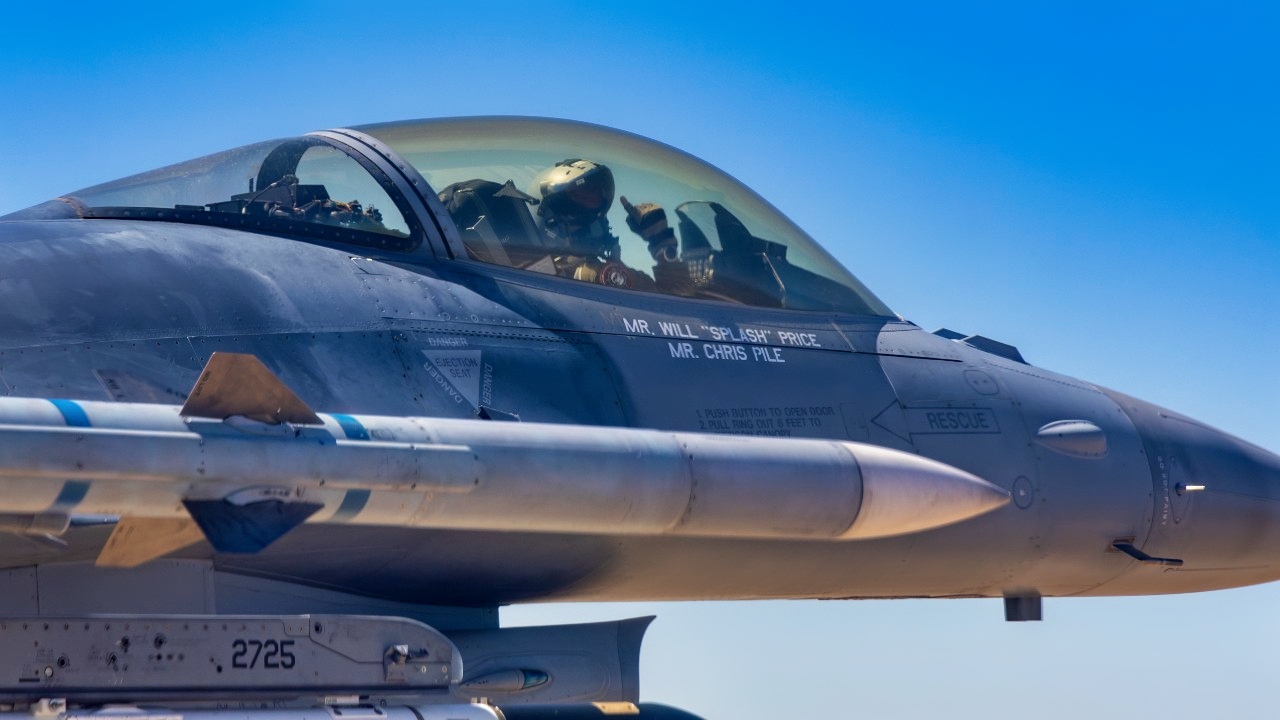 Edwards AFB F-16C 88-456 with its special 50th Anniversary Fighting Falcon tail flash flies over the desert of Southern California. This Viper is assigned to the 416th Flight Test Squadron, flown by outgoing 416th FLTS Commander Lt. Col. Michael Pacini on his last flight with the Skulls. (Air Force photo by Todd Schannuth)