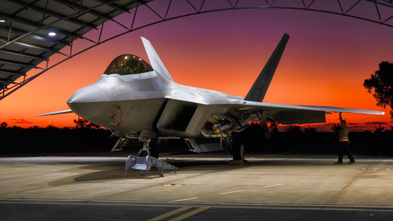 U.S. Air Force Tech. Sgt. Reggie Fernandez, 199th Air Expeditionary Squadron F-22 Raptor crew chief, conducts a basic post-flight inspection at Royal Australian Air Force Base Tindal, Northern Territory, Australia, July 29, 2023. Maintaining and building trust with like-minded allies & partners is crucial to a free and open Indo-Pacific. (U.S. Air National Guard photo by Master Sgt. Mysti Bicoy)