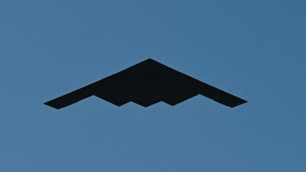 A U.S. Air Force B-2 Spirit, assigned to the 509th Bomb Wing, Whiteman Air Force Base, Mo., is flanked by two U.S. Air Force F-22 Raptors, assigned to the 1st Fighter Wing, Joint Base Langley-Eustis, Va., while conducting a flyover over the White House in Washington, D.C., July 4, 2025. The B-2 provides penetrating flexibility and effectiveness inherent in manned bombers. (U.S. Air Force photo by Airman 1st Class Geneva Nguyen)