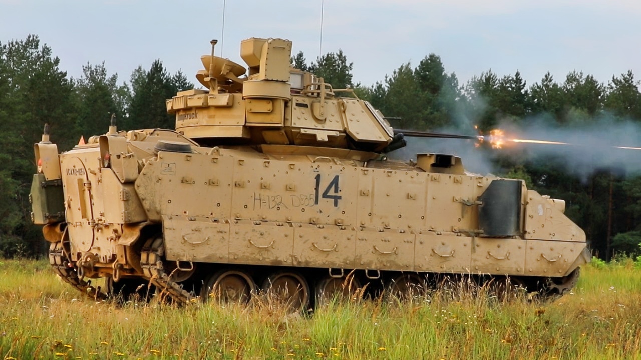 Troopers with 3rd Armored Brigade Combat Team, 1st Cavalry Division firing the 25mm canon on a Bradley fighting vehicle in order to zero the vehicles weapons systems at a range in Poland. Ranges such as these familiarize troopers with the vehicles systems in order to ensure combat readiness. US Army Photo.