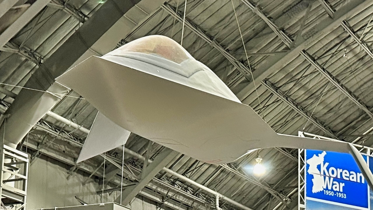 YF-118G Bird of Prey Hanging Above F-22