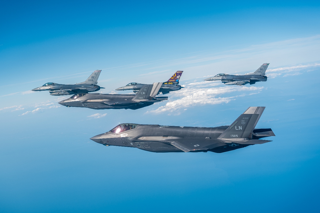 A formation of U.S. Air Force F-35 Lighting IIs and F-16 Fighting Falcons assigned to the 48th and 31st Fighter Wings respectively fly in formation as a part of Exercise Combined Strike along the coast of Italy, August 18, 2025. Exercises like Combined Strike ensure USAFE remains ready and postured to rely on one another to defend the area of responsibility. (U.S. Air Force photo by Senior Airman Zachary Jakel)