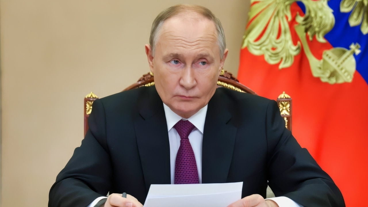 Russia's President Putin Sitting at a Desk