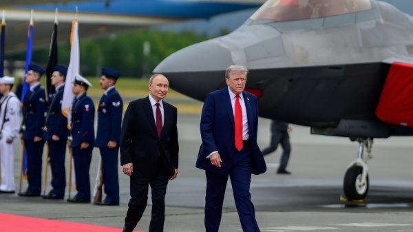 President Donald Trump and Russian president Vladimir Putin walk on the tarmac at Joint Base Elmendorf Richardson in Anchorage, Alaska, Friday, August 15, 2025. (Official White House Photo by Daniel Torok)