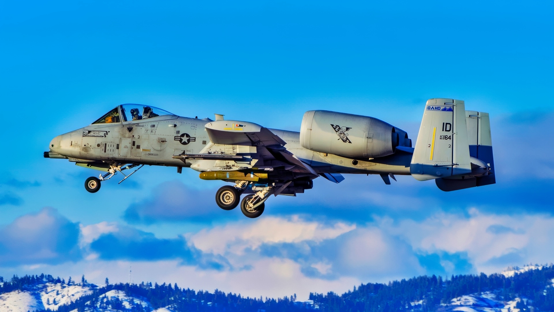 Idaho National Guard pilots land A-10 Thunderbolt IIs after a flight mission near Gowen Field on March 15, 2023 with the Boise foothills in the background. (U.S. National Guard photo by Master Sgt. Becky Vanshur)