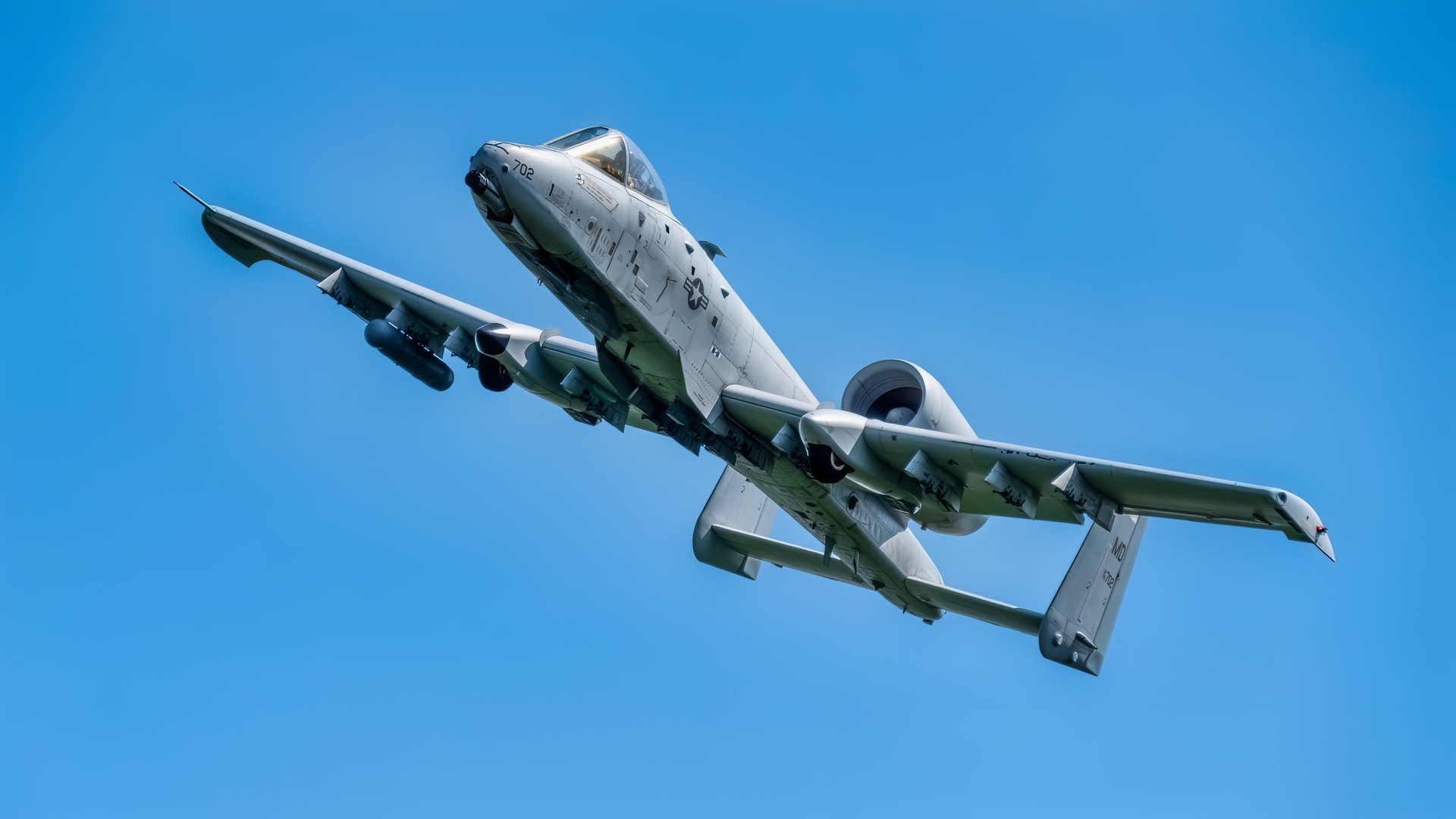 A Maryland Air National Guard A-10C Thunderbolt II, aircraft 702, from the 104th Fighter Squadron, flies through the air over Bollen Air-to-Ground Range, Fort Indiantown Gap, Pennsylvania, August 9, 2025. Family, friends and aviation enthusiasts attended the 104th Fighter Squadron Family Range Day to see the jets in action before the anticipated final divestment of the A-10C Thunderbolt II in September. (U.S. Air National Guard Photo by Airman 1st Class Sarah Hoover)