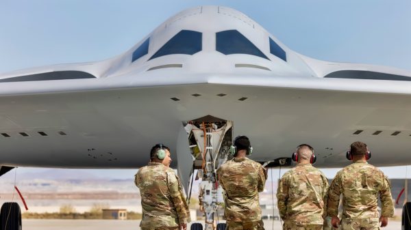 U.S. Air Force Airmen with the 912th Aircraft Maintenance Squadron prepare to recover the second B-21 Raider to arrive for test and evaluation at Edwards AFB, Calif., Sept. 11, 2025. The arrival of a second test aircraft provides maintainers valuable hands-on experience with tools, data and processes that will support future operational squadrons. (U.S Air Force photo by Kyle Brasier)