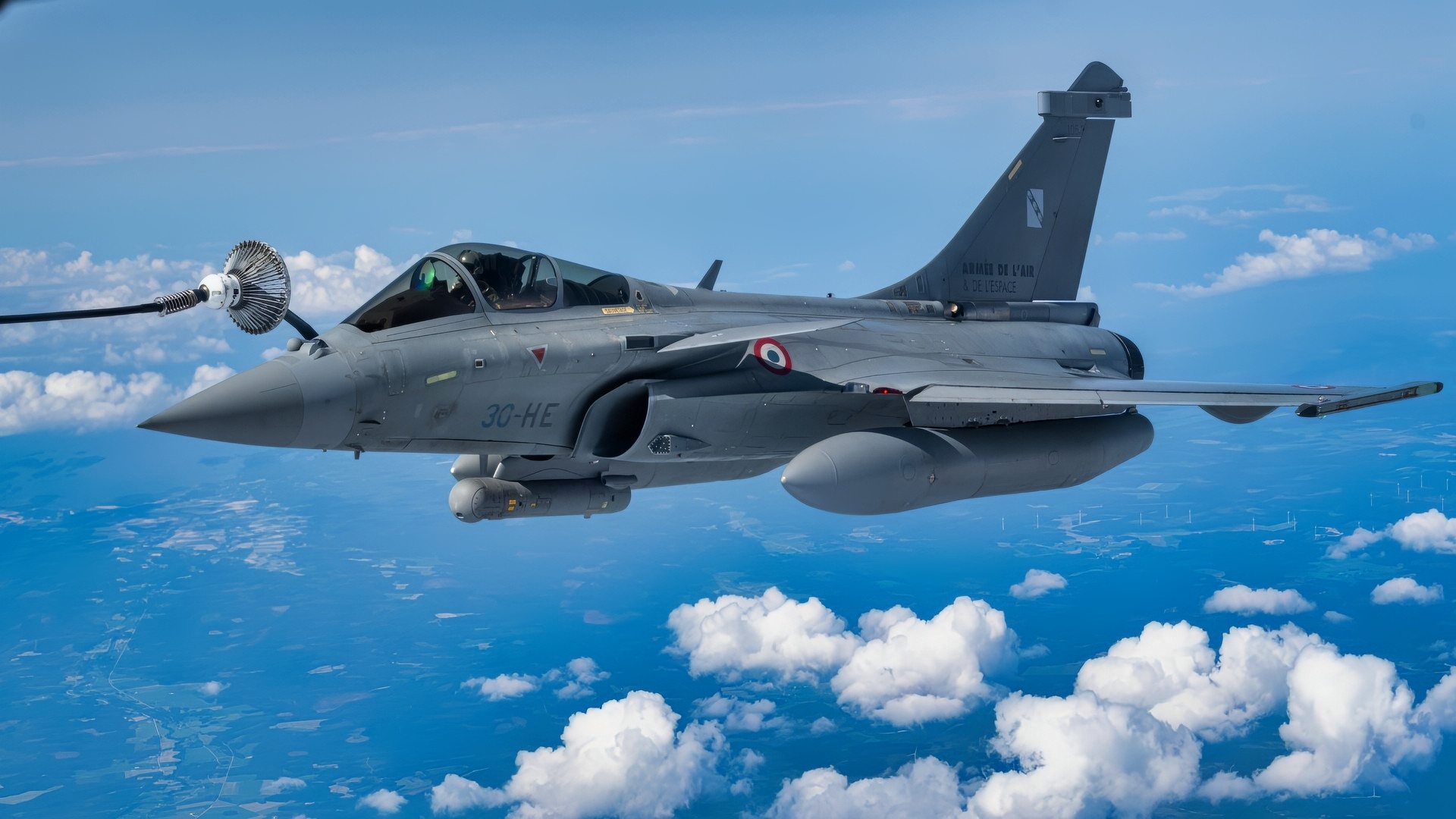 A French Air and Space Force Rafale C from Mont-de-Marsan, Fighter Regiment 2/30, Normandie-Niémen, receives fuel from a U.S. Air Force KC-135 Stratotanker from the 100th Air Refueling Wing, RAF Mildenhall, England, during exercise Atlantic Trident 25 over Finland, June 26, 2025. Atlantic Trident 25 is a recurring multinational training exercise between the U.S., U.K. and France to train in an interoperable environment, refining operational integration and ensuring Allied forces can seamlessly secure the Euro-Atlantic region. Finland hosted this iteration of the training series for the first time. (U.S. Air Force photo by Senior Airman Christopher Campbell)