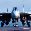 At sea aboard USS Abraham Lincoln (CVN 72)-- A lone plane captain conducts a walk around inspection of his F-14D Tomcat that is assigned to Fighter Squadron Three One (VF-31). THe F-14D is armed with AIM-9 Siderwinder Missiles and a Joint Direct Attack Munition (JDAM) and a GBU-14. USS Abraham Lincoln (CVN 72) and Carrier Air Wing FOURTEEN (CVW 14) are conducting combat operations in support of Operation Southern Watch. U.S. Navy photo by Photographer's Mate Third Class (AW/PJ) Philip A. McDaniel. Cleared for release by ALBG PAO, LCDR Jeff Bender.