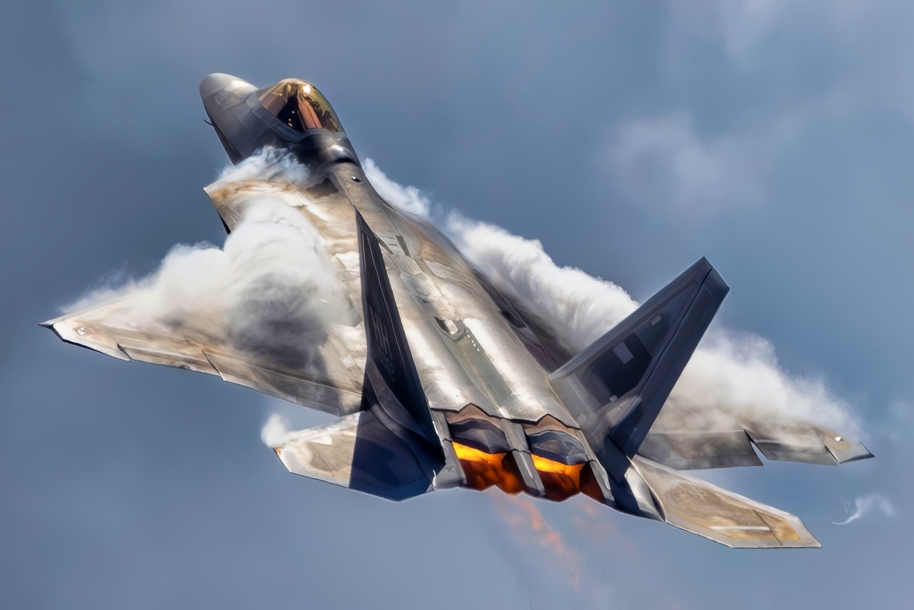 An F-22 Raptor performs an aerial demonstration at Marine Corps Air Station Kaneohe Bay, Hawaii, Aug. 8, 2025. The rapid change in angle of attack causes visible vapor to form around the aircraft, giving spectators a clear view of the jet’s aerodynamic performance. This demonstration highlights the unique thrust-vectoring capabilities of the F-22, allowing it to achieve extreme agility unmatched by other fighter aircraft. (U.S. Air Force photo by Staff Sgt. Lauren Cobin).