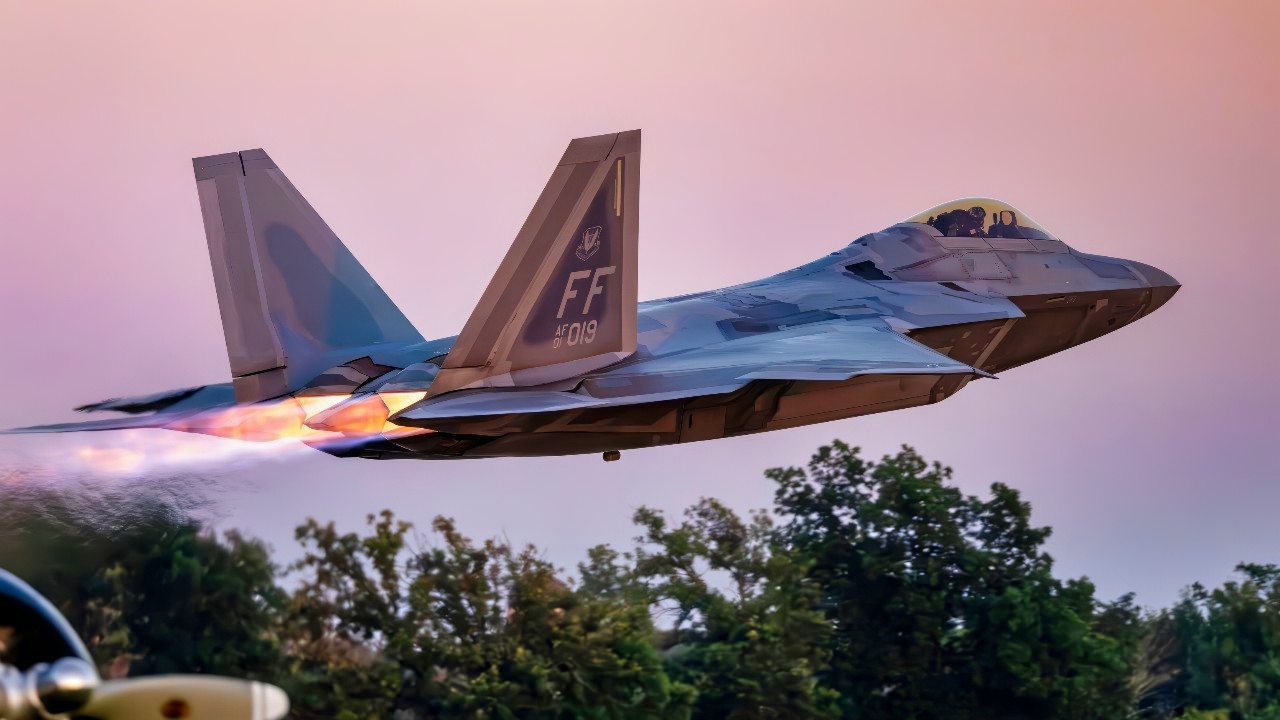 U.S. Air Force Capt. Nick “Laz” Le Tourneau, pilot and commander of the F-22 Raptor Aerial Demonstration Team, launches an F-22 Raptor during the night show at EAA AirVenture, Oshkosh, Wisconsin, July 26, 2025. The afterburners illuminate the night sky, creating a striking visual as the aircraft accelerates into flight. This takeoff gives spectators a front-row view of the F-22’s power, speed, and advanced capabilities, showcasing the skill of Airmen who operate and maintain the jet. (U.S. Air Force photo by Staff Sgt. Lauren Cobin)