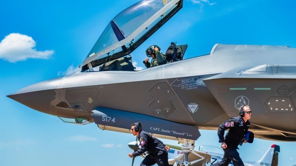 F-35 Demonstration Team members sprint to their positions during the ground show at the Defenders of Liberty Air & Space Show at Barksdale Air Force Base, La., May 17, 2019. The team’s ground show consists of pre-flight inspections with sharp, quick-paced movements that showcase the pride and professionalism of the U.S. Air Force. (U.S. Air Force Photo by Senior Airman Alexander Cook)