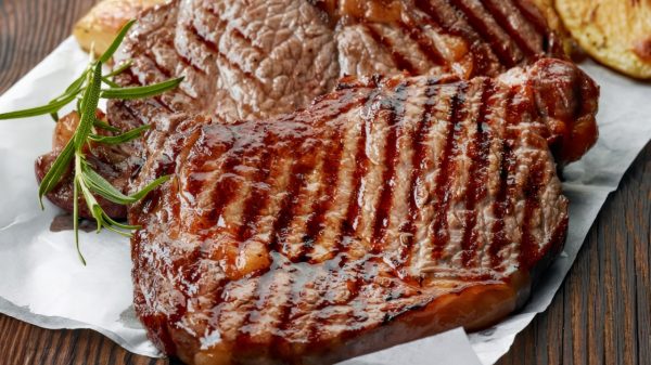 Grilled beef steak on white baking paper. Image Credit: Creative Commons.