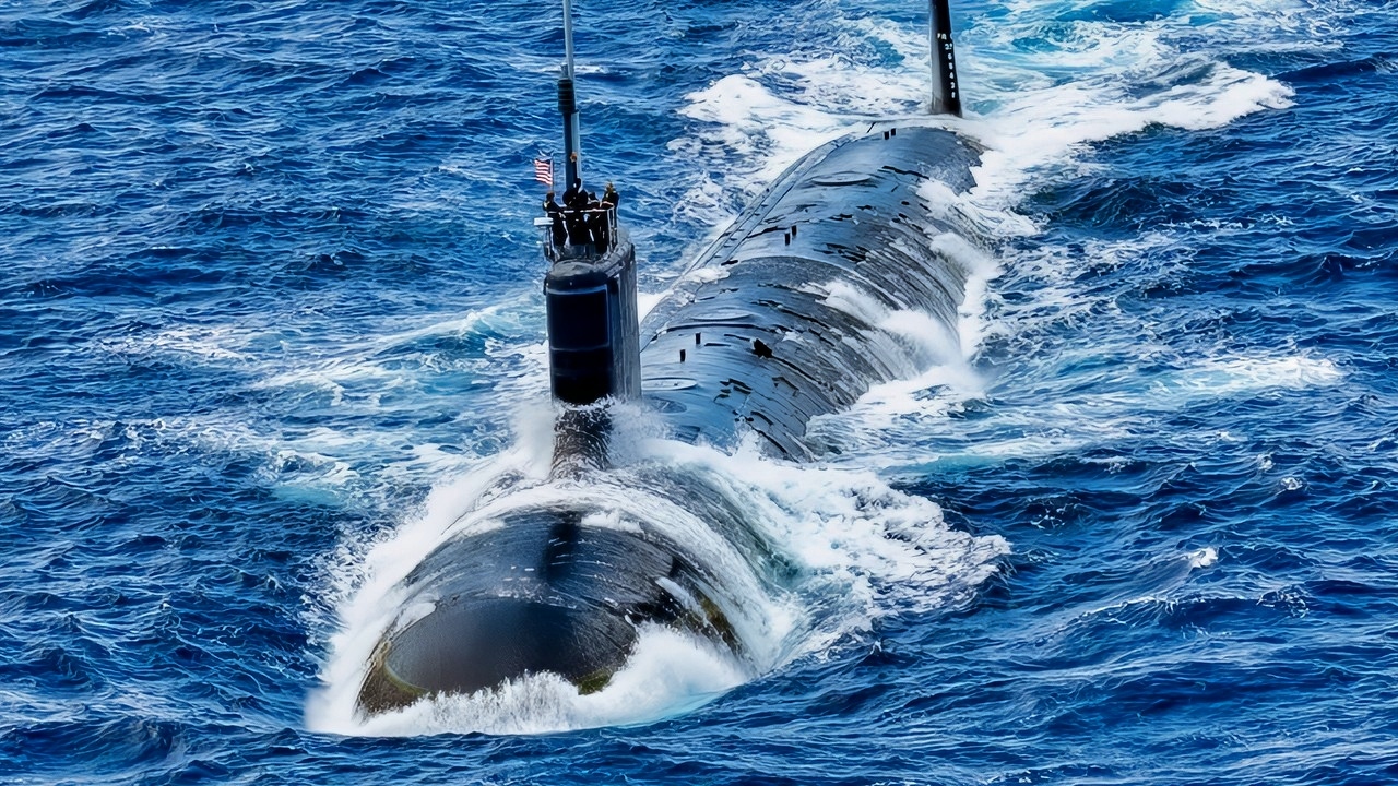 Virginia-class attack submarine USS North Carolina (SSN 777) sails in formation, off the coast of Hawaii during Exercise Rim of the Pacific (RIMPAC) 2024, July 22. Twenty-nine nations, 40 surface ships, three submarines, 14 national land forces, more than 150 aircraft and 25,000 personnel are participating in RIMPAC in and around the Hawaiian Islands, June 27 to Aug. 1. The world's largest international maritime exercise, RIMPAC provides a unique training opportunity while fostering and sustaining cooperative relationships among participants critical to ensuring the safety of sea lanes and security on the world's oceans. RIMPAC 2024 is the 29th exercise in the series that began in 1971. (U.S. Navy photo by Mass Communication Specialist 1st Class John Bellino)