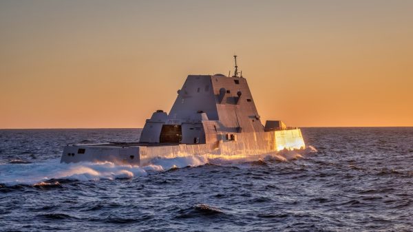 (February 10, 2024) — The Zumwalt Class Guided Missile Destroyer USS Michael Monsoor (DDG 1001) breaks away from the Henry J. Kaiser-class fleet replenishment oiler USNS Pecos (T-AO 197) shortly before sunset after taking on fuel. (U.S. Navy photo by Chief Mass Communication Specialist Mark D. Faram)