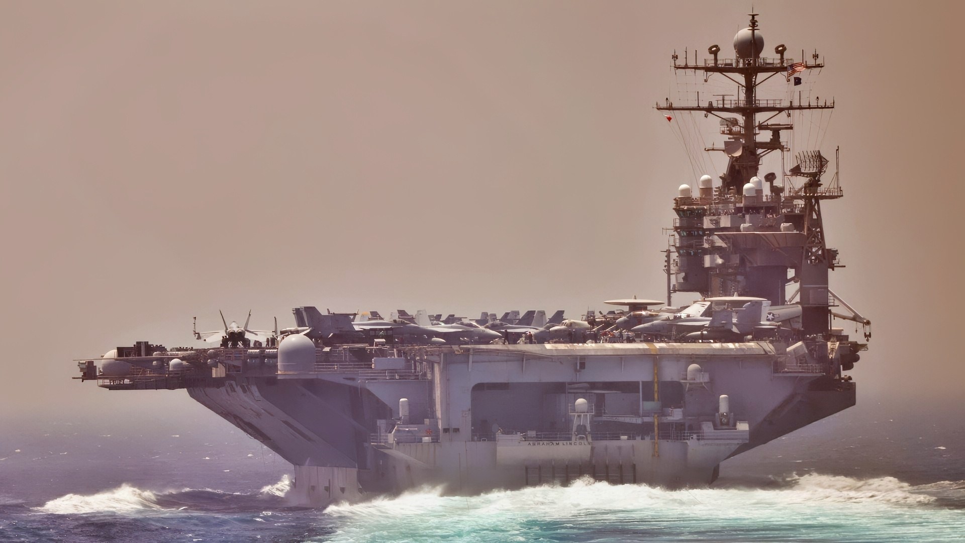 STRAIT OF HORMUZ (May 1, 2012) The aircraft carrier USS Abraham Lincoln (CVN 72), left, and the guided-missile cruiser USS Cape St. George (CG 71) transit the Strait of Hormuz. Abraham Lincoln and Cape St. George are deployed to the U.S. 5th Fleet area of responsibility conducting maritime security operations, theater security cooperation efforts and support missions as part of Operation Enduring Freedom. (U.S. Navy photo by Mass Communication Specialist 3rd Class Alex R. Forster/Released)