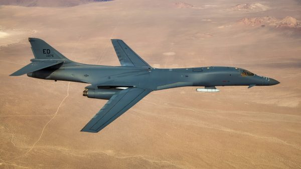 A B-1B Lancer with a Joint Air-to-Surface Standoff Missile (JASSM) flies in the skies above Edwards Air Force Base, California, Nov. 20. The flight was a demonstration of the B-1B’s external weapons carriage capabilities. (Air Force photo by Ethan Wagner)