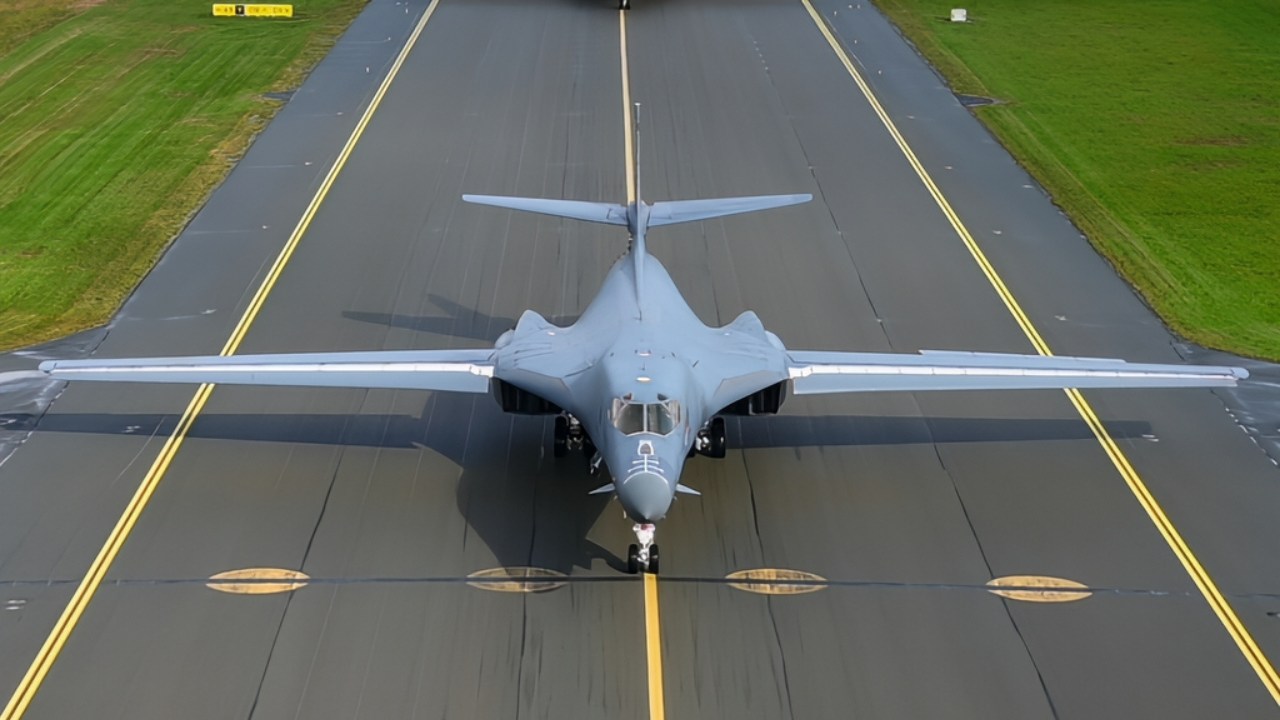 A U.S. Air Force Airman, assigned to the 345th Expeditionary Bomb Squadron, stands a B-1B Lancer during a Bomber Task Force Europe mission at Ørland Air Base, Norway, Aug. 21, 2025. BTF missions expose and familiarize aircrew with air bases and operations in different geographic combatant command areas of operations to enable strategic access and integration with coalition forces to deter global conflict. (U.S. Air Force photo by Staff Sgt. Tambri Cason)