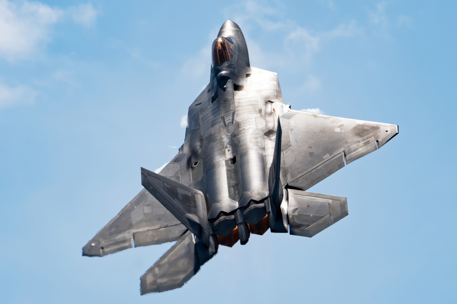 Maj. Joshua “Cabo” Gunderson, F-22 Raptor Demo Team commander and pilot, maneuvers into a climb after a tactical-pitch at the Cold Lake Air Show July 17, 2022, at Cold Lake, Alberta, Canada. The F-22 Raptor's two Pratt and Whitney F119 Turbofan engines bring a combined 70,000 pounds of thrust in combination with two-dimensional thrust vectoring to enable maximum maneuverability for the multi-role air-to-air stealth fighter. (U.S. Air Force photo by Tech. Sgt. Don Hudson)
