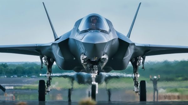 A U.S. Marine Corps plane captain assigned to the Marine Fighter Attach Squadron 225 (VMFA-225) signals to a pilot in a F35B Lightning II as it taxis on the flightline after landing in the U.S. Southern Command Area of Responsibility, Sept. 13, 2025. U.S. military forces are deployed to the Caribbean in support of the U.S. Southern Command mission, Department of War-directed operations, and the president’s priorities. (U.S. Air Force photo by Senior Airman Katelynn Jackson)