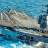 USS Gerald R. Ford (CVN 78) conducts high-speed turns in the Atlantic Ocean. Ford is at sea conducting sea trials following the in port portion of its 15 month post-shakedown availability. (U.S. Navy photo by Mass Communication Specialist 3rd Class Connor Loessin).