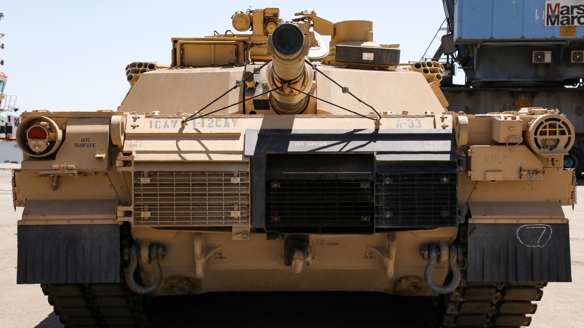A U.S. Army M1A3 Abrams Tank from the 1-12 Cavalry Squadron, 1st Cavalry Division waiting to be guided onto a loading vehicle and secured for transport at the Port of Agadir, June 3, 2022, Agadir, Morocco. African Lion 2022 is U.S. Africa Command’s largest, premier, joint, annual exercise hosted by Morocco, Ghana, Senegal and Tunisia, June 6 - 30. More than 7,500 participants from 28 nations and NATO train together with a focus on enhancing readiness for U.S. and partner nation forces. AL22 is a joint all-domain, multi-component and multinational exercise, employing a full array of mission capabilities with the goal to strengthen interoperability among participants and set the theater for strategic access. (U.S. Army photo by PFC Donald Franklin)
