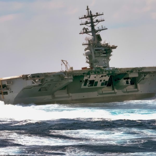 The Nimitz-class aircraft carrier USS Dwight D. Eisenhower conducts rudder turns during sea trials.