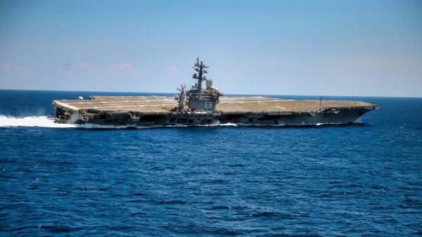 The Nimitz-class aircraft carrier USS Dwight D. Eisenhower conducts rudder turns during sea trials. Dwight D. Eisenhower completed a nine-month planned incremental availability at Norfolk Naval Ship Yard on June 10 and is scheduled to resume underway operations this summer.