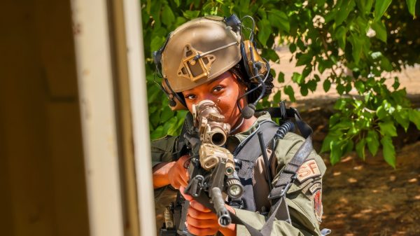 U.S. Air Force Airman 1st Class Janae Whaley, 9th Security Forces Squadron Tactical Response Team (TRT), performs a breach and clear during training at Beale Air Force Base, California, Aug. 27, 2024. Whaley is the first female member to pass the intense training and be selected for Beale’s TRT. (U.S. Air Force photo by Staff Sgt. Frederick A. Brown)