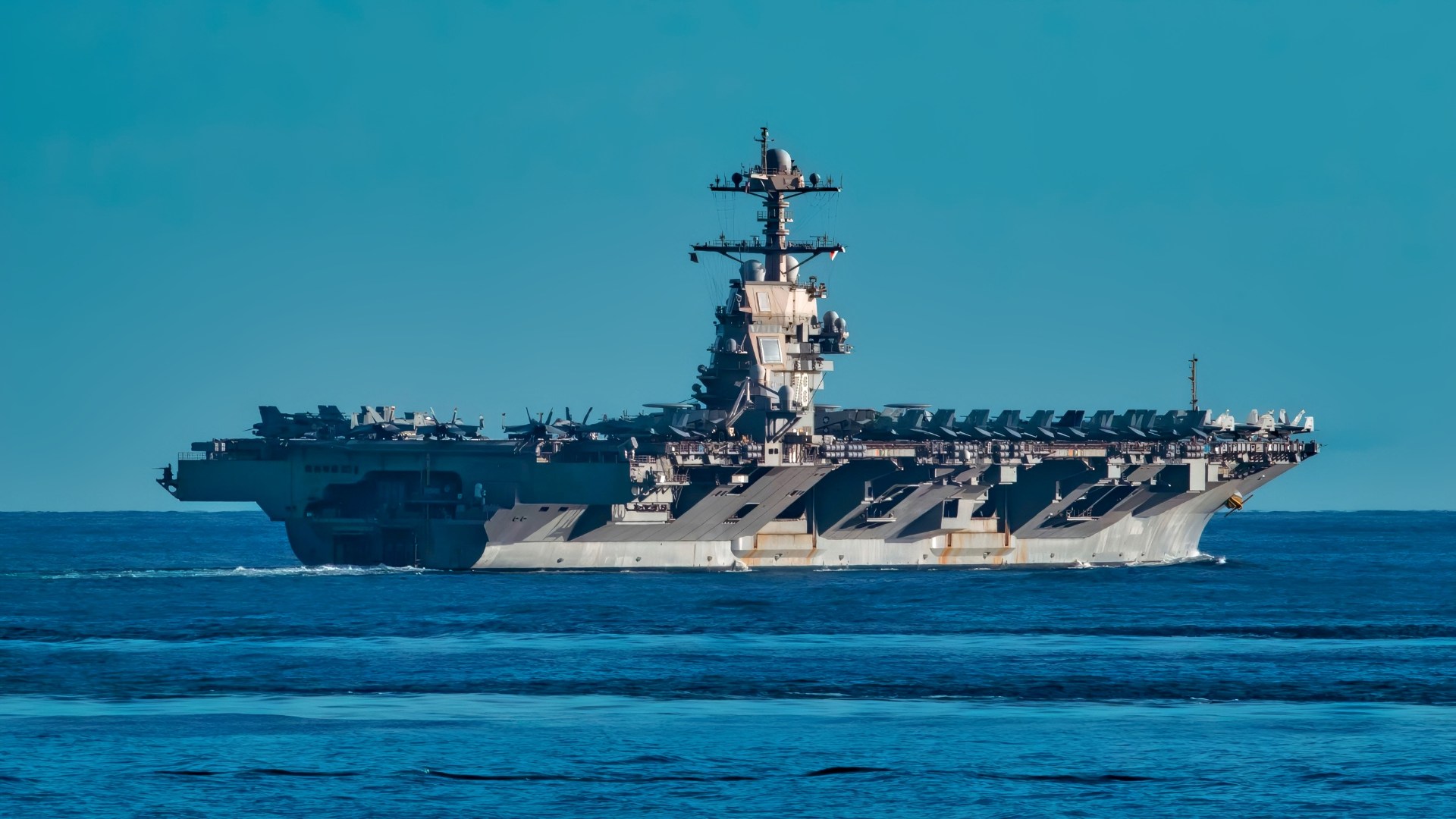 The Arleigh Burke-class guided-missile destroyer USS Winston S. Churchill (DDG 81) sails alongside the world’s largest aircraft carrier the USS Gerald R. Ford (CVN 78), Sep. 24, 2025. Winston S. Churchill, as part of Carrier Strike Group 12, is on a scheduled deployment in the U.S. 6th Fleet area of operation to support the warfighting effectiveness, lethality and readiness of U.S. Naval Forces, Europe-Africa, and defend U.S. Allied and partner interest in the region. (U.S. Navy photo by Mass Communication Specialist Seaman Hector Rodriguez)