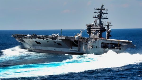 The Nimitz-class aircraft carrier USS Dwight D. Eisenhower conducts rudder turns during sea trials. Dwight D. Eisenhower completed a nine-month planned incremental availability at Norfolk Naval Ship Yard on June 10, 2011.