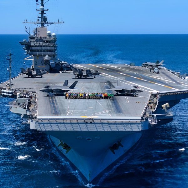 ATLANTIC OCEAN (Aug. 16, 2016) Sailors assigned to the Grim Reapers of Strike Fighter Squadron (VFA) 101, the Navy’s F-35C Fleet replacement squadron, pose on the flight deck of the aircraft carrier USS George Washington (CVN 73) during an aerial photo exercise. VFA-101 aircraft and pilots are conducting initial qualifications aboard George Washington in the Atlantic Ocean. The F-35C is expected to be Fleet operational in 2018. (U.S. Navy photo by Mass Communication Specialist Seaman Apprentice Krystofer Belknap)