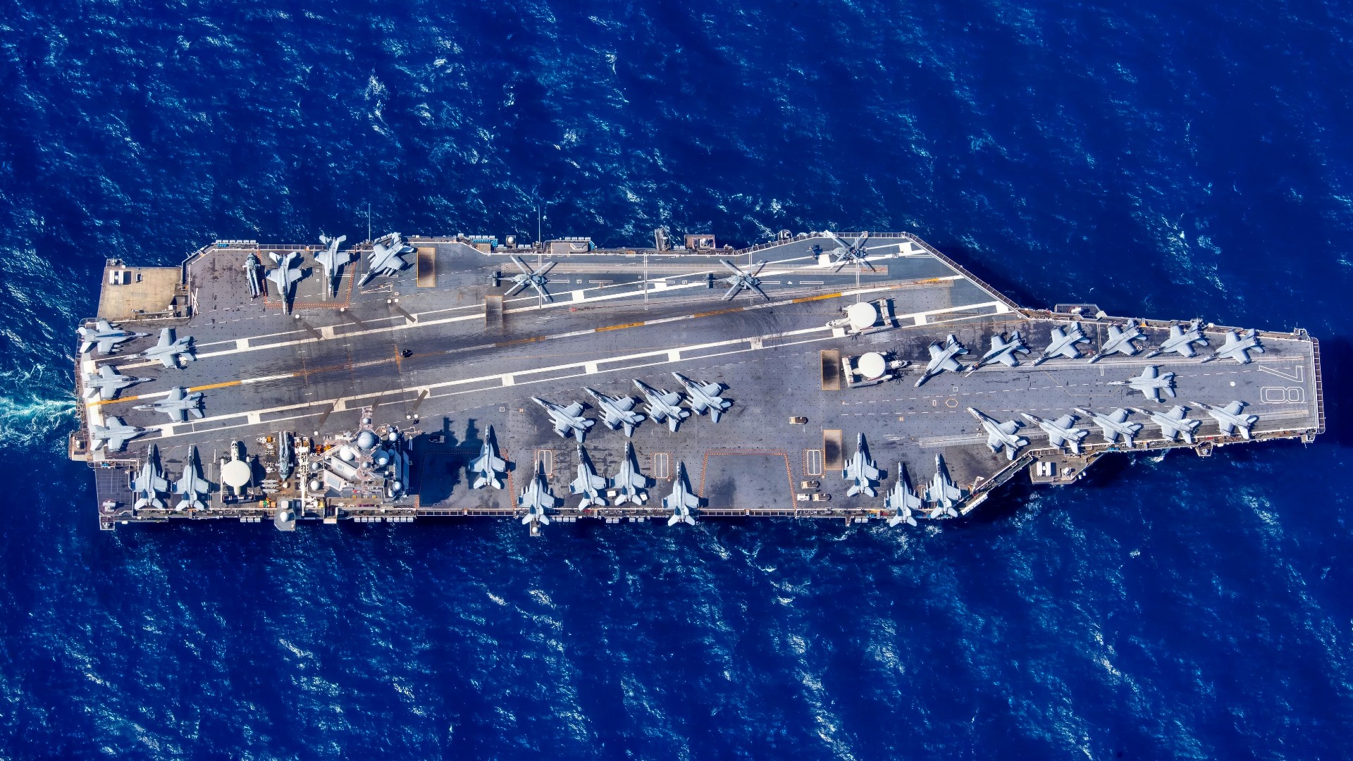 The first-in-class aircraft carrier USS Gerald R. Ford (CVN 78) transits the Atlantic Ocean, March 19, 2023. Ford is underway in the Atlantic Ocean executing its Composite Training Unit Exercise (COMPTUEX), an intense, multi-week exercise designed to fully integrate a carrier strike group as a cohesive, multi-mission fighting force and to test their ability to carry out sustained combat operations from the sea. As the first-in-class ship of Ford-class aircraft carriers, CVN 78 represents a generational leap in the U.S. Navy’s capacity to project power on a global scale. (U.S. Navy photo by Mass Communication Specialist 2nd Class Jackson Adkins)