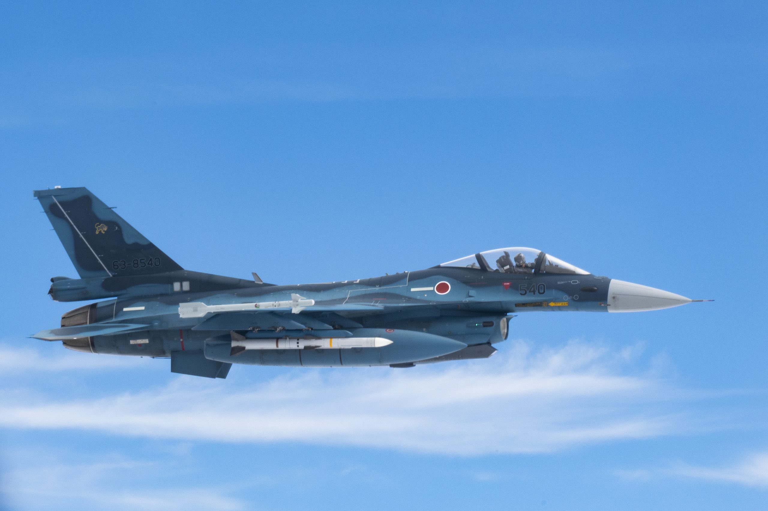 A Koku Jieitai (Japan Air Self-Defense Force) F-2 aircraft flies in formation with a U.S. Air Force B-52H Stratofortress, assigned to the 2nd Bomb Wing, Barksdale Air Force Base, Louisiana, during a Bomber Task Force mission over the Indo-Pacific region, September 21, 2021. Bomber missions provide opportunities to train and work with allies and partners in joint and coalition operations and exercises. (U.S. Air Force photo by Staff Sgt. Devin M. Rumbaugh)
