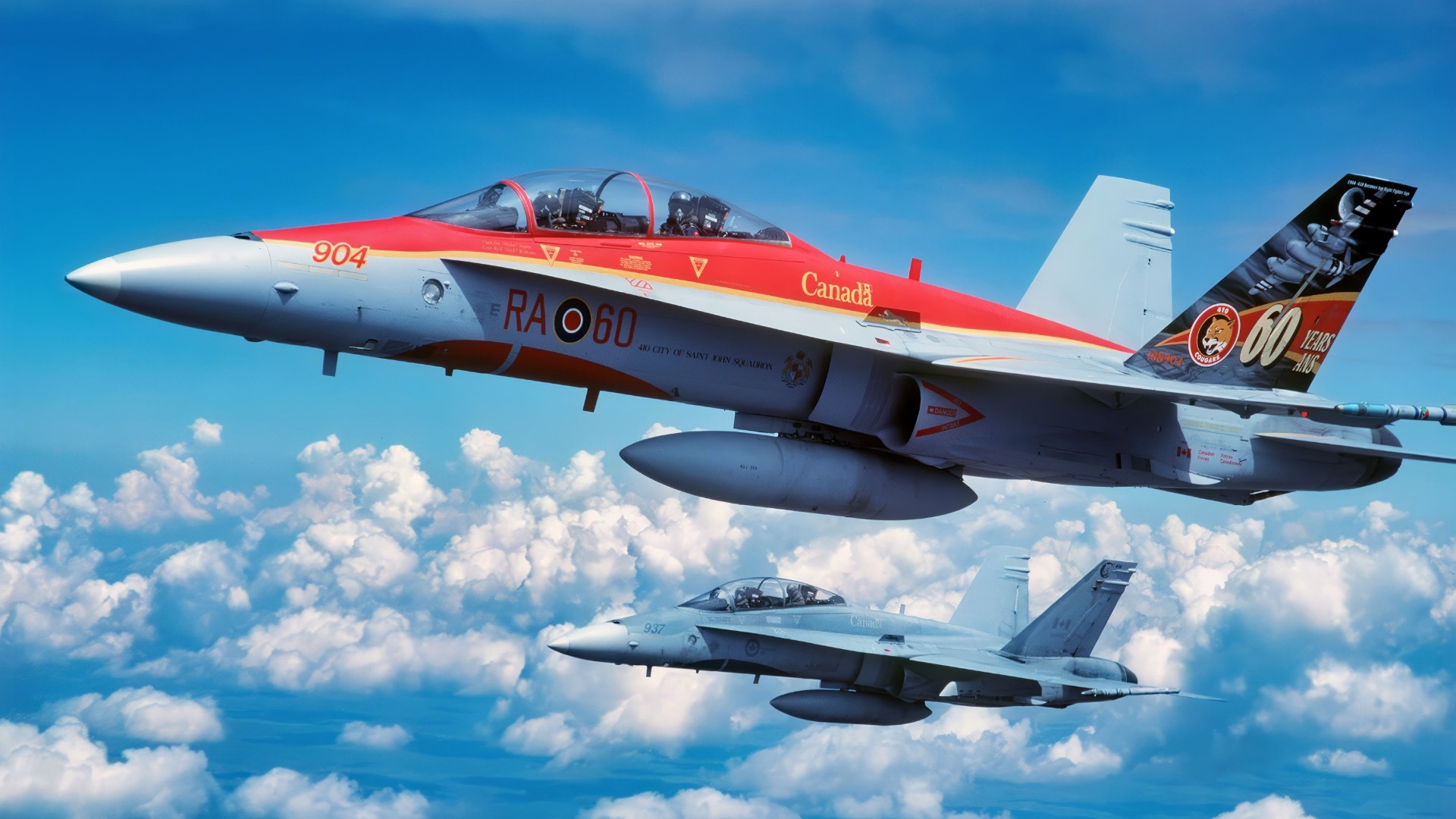 Two Canadian Forces, 410 Squadron CF-188B Multi-Role Fighters, one painted in special anniversary colors, flying over the Utah Test and Training Range (UTTR) for planned engagements during the Tiger Meet of the Americas. The Inaugural Tiger Meet of the Americas brought together flying units from throughout North America that have a Tiger or large cat as their unit symbol. The Tiger Meet of the Americas closely mirrors the North Atlantic Treaty Organization (NATO)/Europe Tiger Meet in its goal of fostering camaraderie, teamwork and tactics familiarization.