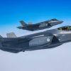 Two Dutch F-35 Lightnings patiently wait for their opportunity to maneuver into position to receive more fuel mid-air from a KC-135 Stratotanker over the Arctic Circle, May 31, 2023. The 101st ARW is taking part in Arctic Challenge Exercise 2023, a live fly exercise that serves to advance arctic security initiatives and enhance interoperability in the increasingly dynamic and contested region.