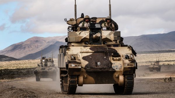 FORT IRWIN, Calif. – A Main Battle Tank and Infantry Fighting Vehicles of Dealer Troop, 1st Squadron, 11th Armored Cavalry Regiment approach the town of Barasu in the National Training Center to stage a counterattack against the 2nd Armored Brigade Combat Team, 1st Cavalry Division, Feb. 20, 2017. The counterattack by the 11th ACR challenged the 2/1 ABCT to combat a well-equipped and formidable opponent while defending an urban objective. (U.S. Army photo by Pvt. Austin Anyzeski, 11th ACR)