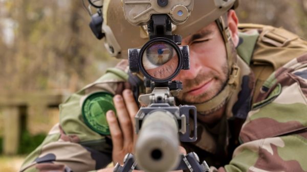 French Staff Sgt. Guillaume Duatriche, a sniper, 1st Infantry Regiment, Republican Guard, look through the scope of the M110 Semi-Automatic Sniper System during the Designated Marksman course at Naval Weapons Station Yorktown, Virginia, April 9, 2024. Duatriche is the first French military member to attend the Designated Marksman Course (DMC), hosted by Marine Corps Security Forces Regiment (MCSFR). MCSFR DMC instructors train students from the U.S. Marine Corps, the Joint Services, and international allies to become highly skilled in marksmanship, range estimation, and observation in support of expeditionary security operations and security for vital assets. (U.S. Marine Corps photo by SSgt. Servante R. Coba)
