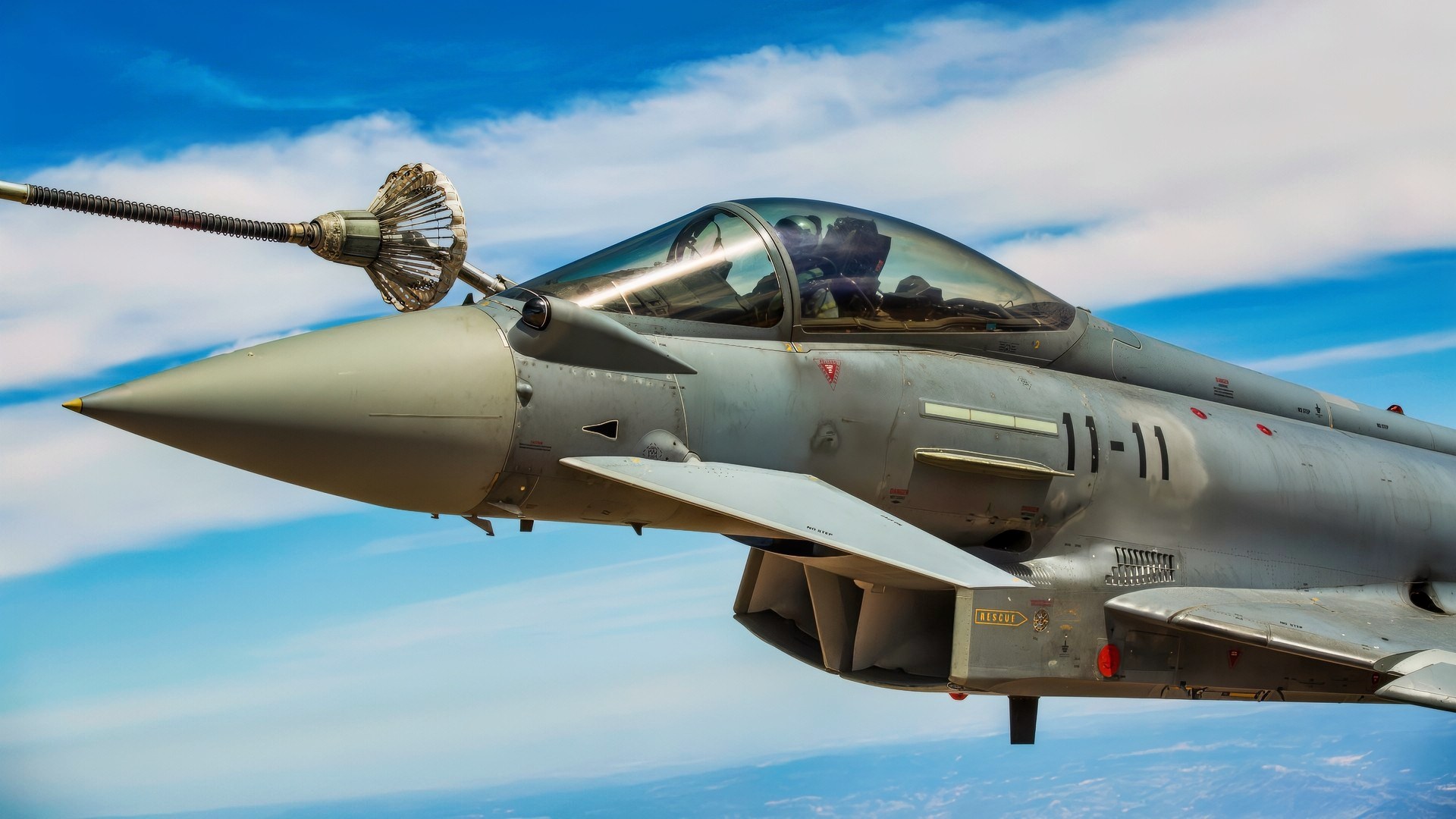 A Eurofighter Typhoon with the Spanish Air Force based out of Morón Air Base, Spain, refuels from a KC-130J Hercules, a first for the Marines from Special-Purpose Marine Air-Ground Task Force Crisis Response-Africa, Aug. 13, in Spain. The U.S. and Spain have been fostering one of the closest defense partnerships around the world for more than 60 years. (U.S. Marine Corps photo by Staff Sgt. Vitaliy Rusavskiy/Released)