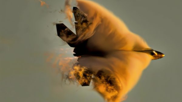 F-22 Raptor Flying in the Dark Clouds