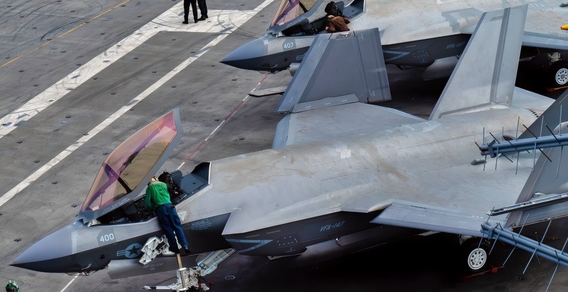 SOUTH CHINA SEA (Jan. 15, 2022) Sailors preform pre-flight checks on several F-35C Lightning II’s, assigned to the “Argonauts” of Strike Fighter Squadron (VFA) 147, on the flight deck of Nimitz-class aircraft carrier USS Carl Vinson (CVN 70), Jan. 14, 2022. Carl Vinson Carrier Strike Group is on a scheduled deployment in the U.S. 7th Fleet area of operations to enhance interoperability through alliances and partnerships while serving as a ready-response force in support of a free and open Indo-Pacific region. (U.S. Navy photo by Mass Communication Specialist Seaman Apprentice Derek Kelley)