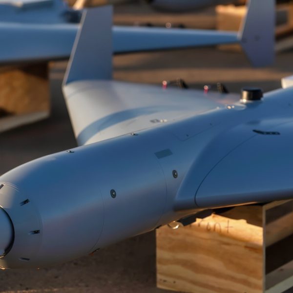 U.S. CENTRAL COMMAND AREA OF RESPONSIBILITY (Nov. 23, 2025) Low-cost Unmanned Combat Attack System (LUCAS) drones are positioned on the tarmac at a base in the U.S. Central Command operating area, Nov. 23. Costing approximately $35,000 per platform, LUCAS drones are providing U.S. forces in the Middle East low-cost, scalable capabilities to strengthen regional security and deterrence. (Courtesy Photo)