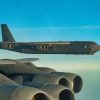 Two B-52 Stratofortresses assigned to the 2nd Bomb Wing from Barksdale Air Force Base, Louisiana fly in a formation after completing missions over the Baltic Sea for Bomber Task Force Europe 20-1, Oct. 23, 2019. This deployment allows aircrews and support personnel to conduct theater integration and improve bomber interoperability with joint partners and allied nations. (U.S. Air Force photo by SSgt. Trevor T. McBride)