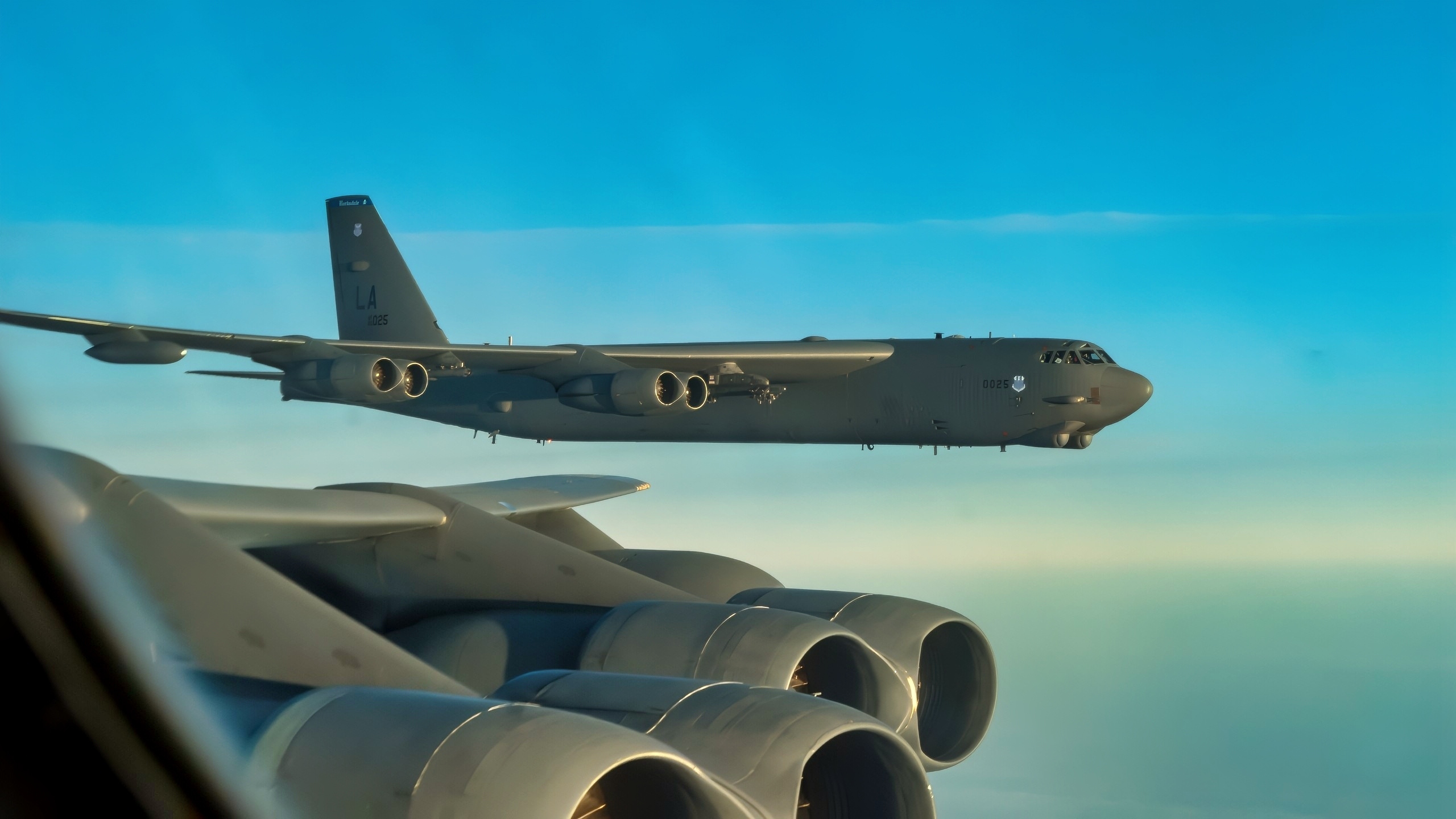 Two B-52 Stratofortresses assigned to the 2nd Bomb Wing from Barksdale Air Force Base, Louisiana fly in a formation after completing missions over the Baltic Sea for Bomber Task Force Europe 20-1, Oct. 23, 2019. This deployment allows aircrews and support personnel to conduct theater integration and improve bomber interoperability with joint partners and allied nations. (U.S. Air Force photo by SSgt. Trevor T. McBride)
