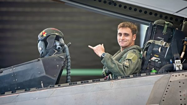 U.S. Air National Guard Capt. Tosh Peila, 199th Fighter Squadron F-22 Raptor pilot, prepares for a training sortie during exercise Sentry Aloha 26-1 at Joint Base Pearl Harbor-Hickam, Hawaii, Jan. 26, 2026. The training demonstrates the capability of the 154th Wing and its partners to lead large-force employment exercises, reinforcing the total force as a vital component of the nation's operational readiness. (U.S. Air National Guard photo by Senior Master Sgt. Mysti Bicoy)