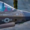 A U.S. Marine conducts pre-flight checks on an F-35B Lighting II, attached to Marine Fighter Attack Squadron (VMFA) 121, on the flight deck of America-class amphibious assault ship USS Tripoli (LHA 7), May 22, 2026. Tripoli is deployed to the U.S. 5th Fleet area of operations to support maritime security and stability in the Middle East. (U.S. Navy photo)